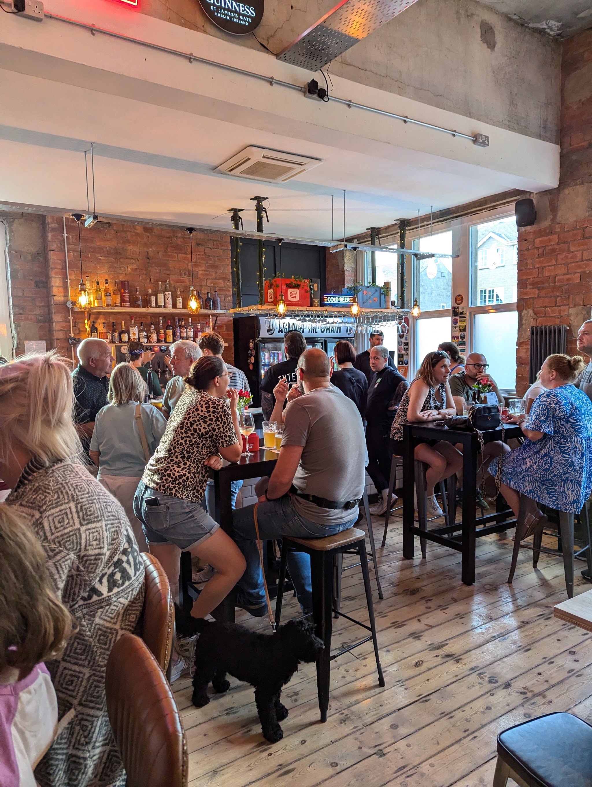 Friends gathered in the exposed-brick bar at Against The Grain Yeadon